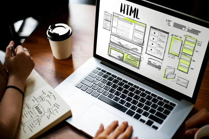 A clean and modern website layout displayed on a laptop screen